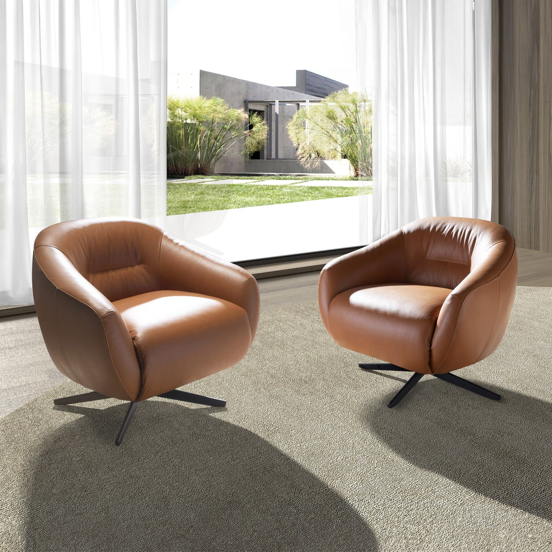 Brown leather swivel armchair